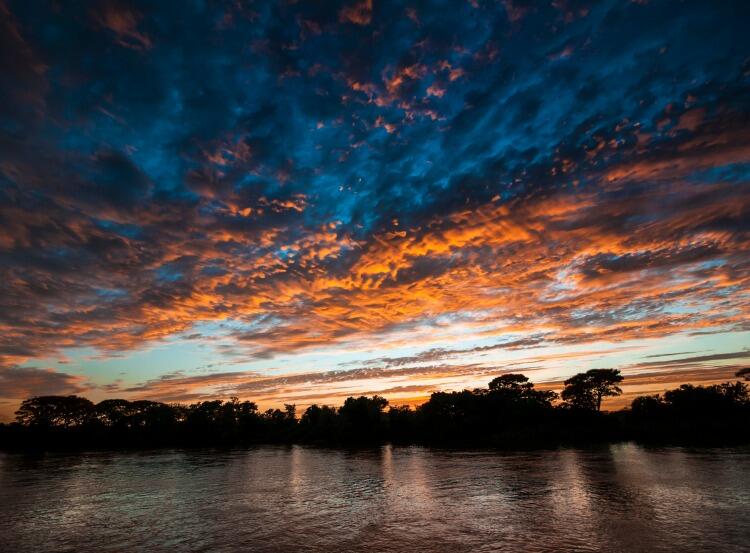 sunset-on-the-cuiaba-river-in-the-pantanal-in-brazil-picture-id506594468